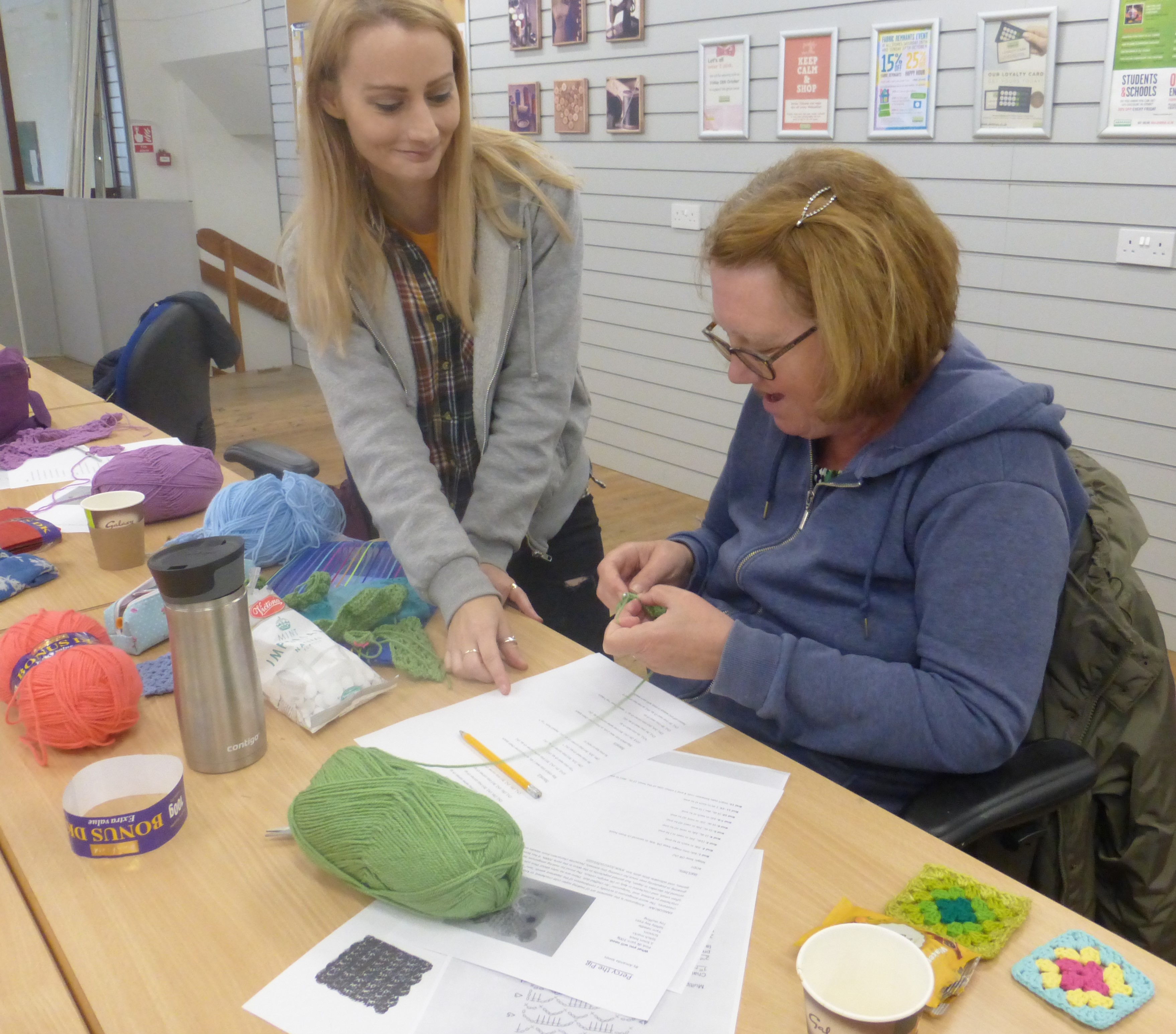 Amanda teaching a woman to crochet at Abakhan craft shop and workshop