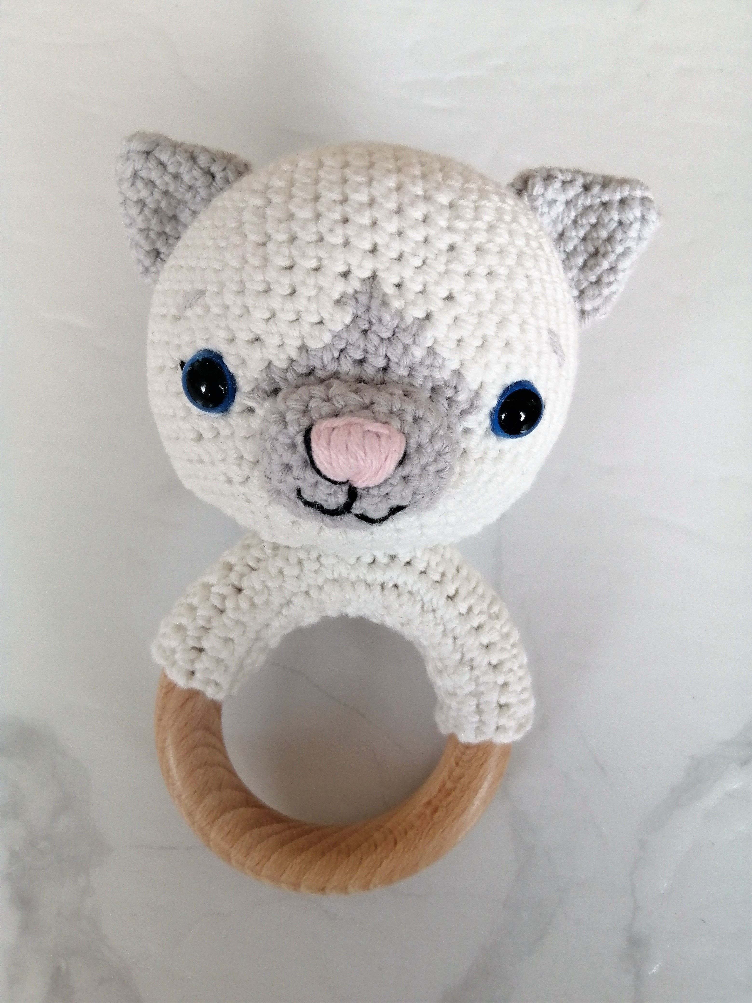 crochet baby rattle, white and grey cat head on a wooden ring